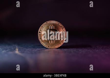 Bitcoin with Golden Glow Reflected on Surface Golden Bitcoin with Light Reflections moody Cryptocurrency Scen *** Bitcoin mit Golden Glow reflektiert Stock Photo