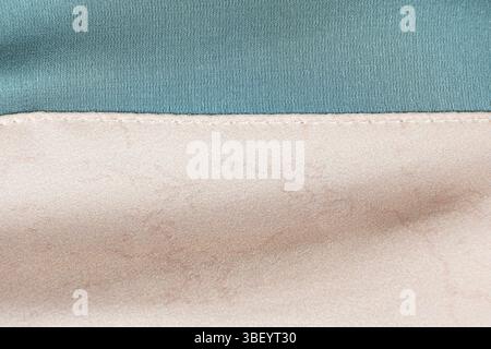 Polyester fabric with a little elastane, macro texture top view. Stitching with threads. Stock Photo