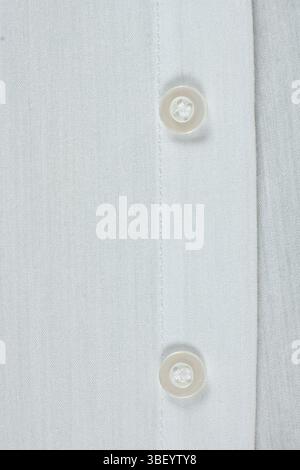 Cotton and polyester fabric clothing, buttons on shirt. Stock Photo