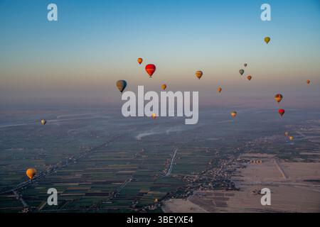 View of other balloons from hot air balloon over Luxor at sunrise, Luxor, Egypt, Africa Stock Photo
