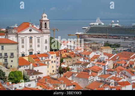 View of cruise ship in port and terrakotta rooftops in Alfama, Alfama District, Lisbon, Portugal, Europe Stock Photo
