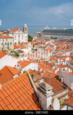 View of cruise ship in port and terrakotta rooftops in Alfama, Alfama District, Lisbon, Portugal, Europe Stock Photo