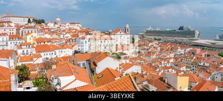 View of cruise ship in port and terrakotta rooftops in Alfama, Alfama District, Lisbon, Portugal, Europe Stock Photo