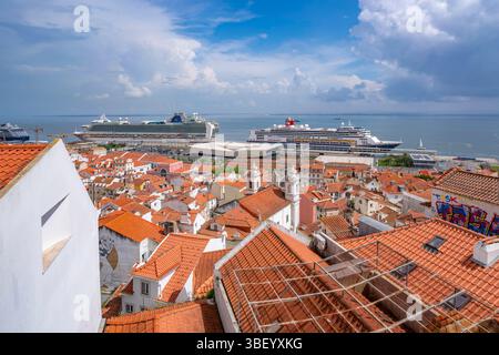 View of cruise ships in port and terrakotta rooftops in Alfama, Alfama District, Lisbon, Portugal, Europe Stock Photo