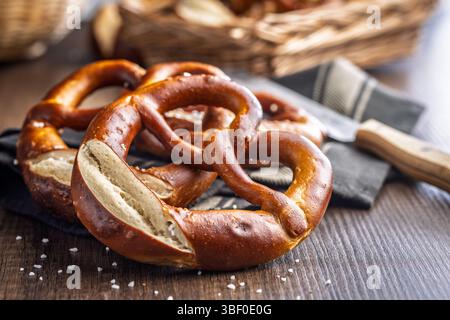 Salted bavarian pretzel on a wooden table. Stock Photo