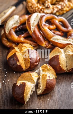 Crunchy bavarian buns on a wooden table. Stock Photo