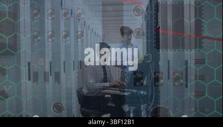 Microprocessor connections over caucasian male and female engineers working at server room Stock Photo