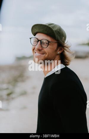 Close-up portrait of a man in glasses and a cap Stock Photo