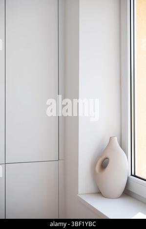 Modern Ceramic Vase on Minimalist Window Sill Stock Photo