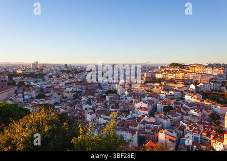 Sunset sky over the historical city centre of Lisbon, as seen from the Castelo de São Jorge's hill in Alfama - Portugal Stock Photo