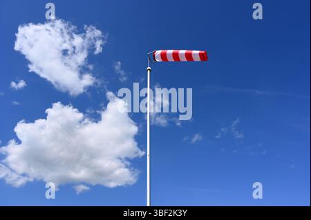 windsock in the colours red white striped Stock Photo