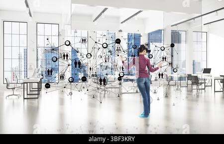 Young woman in casual wearing virtual helmet and working with connection concept. 3d rendering Stock Photo