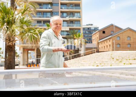 Concentrated elderly man during table tennis game Stock Photo
