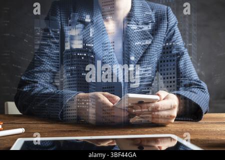 Businesswoman using mobile phone at desk. Close up woman hands and tablet computer. Mobile communication concept with chatting woman. Digital technolo Stock Photo