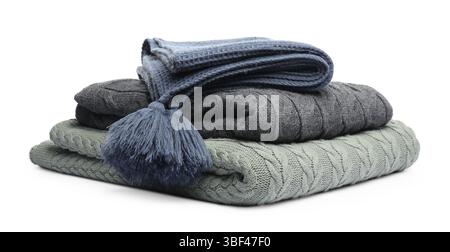 Stack of folded blankets isolated on white Stock Photo