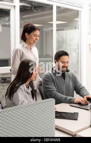 The team engages in a brainstorming session led by their manager, exploring creative strategies for a challenging client project. Stock Photo