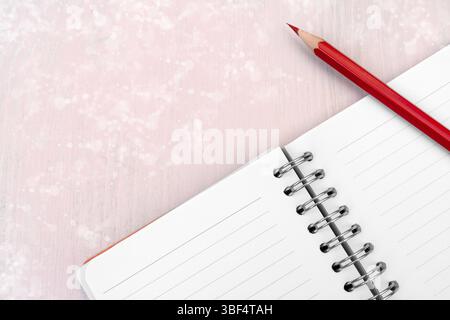 Red pencil and notebook for notes Stock Photo