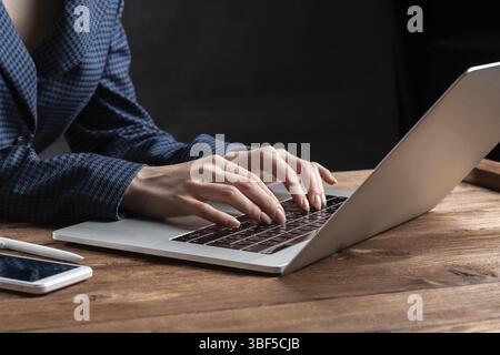 Business lady typing on laptop computer at wooden desk. Strategy planning and banking. Financial analyst working in office. Business accounting and pr Stock Photo