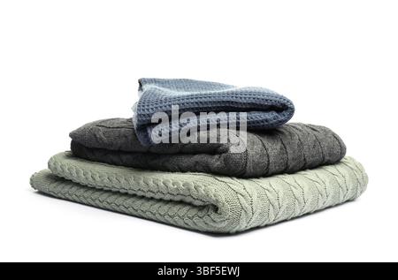 Stack of folded blankets isolated on white Stock Photo