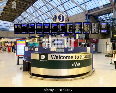 The information desk and electronic departure boards in the main concourse at Reading Railway Station in Reading, Berkshire, UK Stock Photo