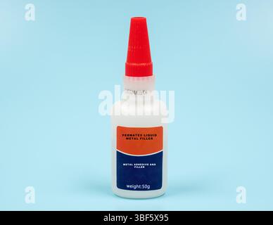 Permatex liquid metal filler. Metal adhesive and filler. A liquid adhesive that bonds and fills gaps in metal parts. Dries quickly and forms a durable, sandable and paintable surface, perfect for automotive and crafting applications. Stock Photo