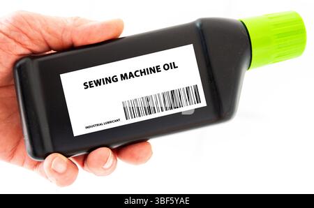 Sewing machine oil. Low-viscosity oil used in sewing machines to reduce friction and prevent wear on moving parts. Stock Photo