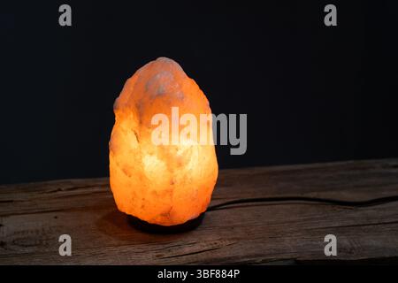 Himalayan salt lamp on black background Stock Photo