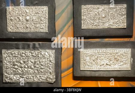 Tampok, muka bantal, pillow-end plates, silver, malaysia. Plates sewd on the pillow Stock Photo