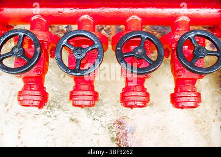 Red Fire Lin Four red fire hydrants on a fire line on a ship Stock Photo - Alamy