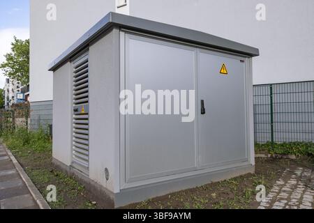 small transformer station outside a residential building Stock Photo