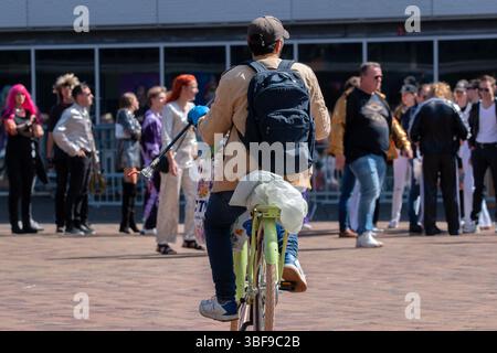 Bicycle Man Looking For Cans And Bottles At Amsterdam The Netherlands 30-5-2025 Stock Photo