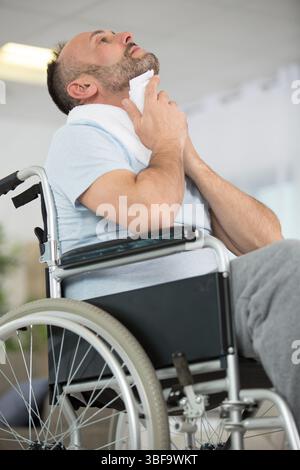 injured man doing exercises at home Stock Photo