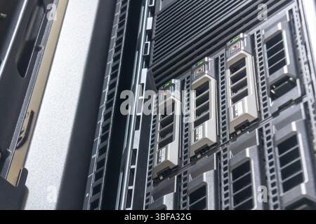 Close-up of server storage modules installed in a data center rack. This image captures the intricate design and organization of modern technology inf Stock Photo
