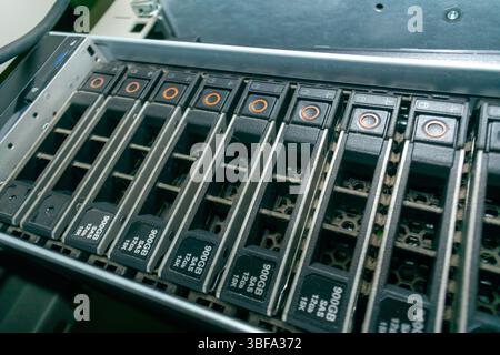 Close-up view of a computer data storage device showcasing multiple slots for hard drives, emphasizing technology in digital information management an Stock Photo