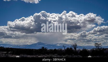 March 24, 2023.  Cumulonimbus clouds seen from Ghost Ranch.  Abiquiu, New Mexico. Stock Photo