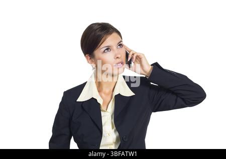 Attractive young brunette businesswoman talking on the phone. Isolated against white background Stock Photo