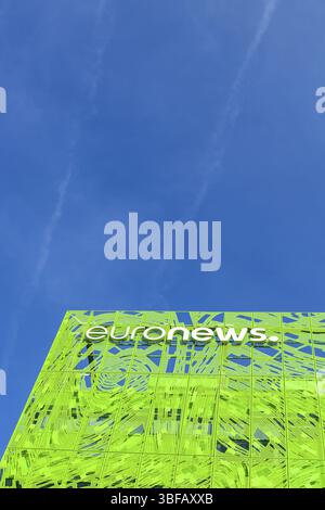 Euronews, european pay television news network brand logo on its headquarter office building located in eco-district Confluence. Blue sky background w Stock Photo