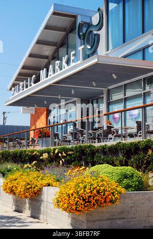 A small garden grows in front of a cafe and organic food market in Napa, California Stock Photo