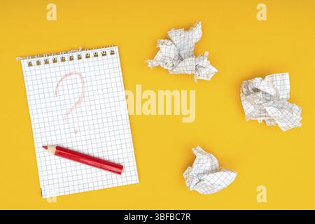 Pencil, notebook and crumpled sheets of paper Stock Photo