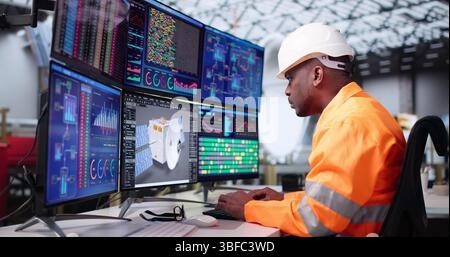 Young Engineer Designs Satellite Model Using 3D CAD Software On Computer. Stock Photo