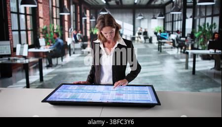Business Woman Analyzing Medical Data In Corporate Office Spreadsheet Presentation. Stock Photo