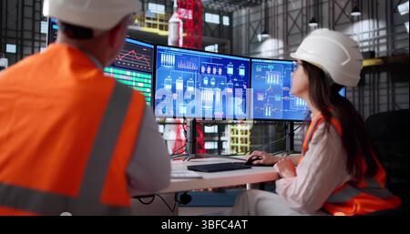 Team Of Engineers Using Scada To Control Moon Exploration Program Stock Photo