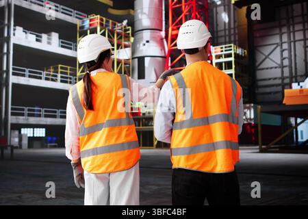 Team Of Engineers Design Rockets At Industrial Factory Facility Stock Photo