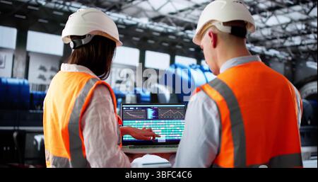 Engineer Uses AI Technology To Monitor Oil And Gas Plant Stock Photo