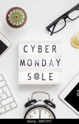 Cyber Monday flat lay on white background. Keyboard, tablet, phone