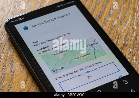 Android smartphone with the Microsoft Authenticator app showing a number to input on a work computer as part of two factor authentication (2FA or TFA) Stock Photo