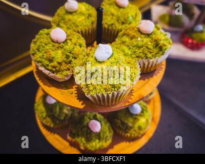Green cupcakes on a wooden stand inspired by nature Stock Photo