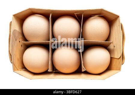 top view of six country brown chicken eggs in plywood box cutout on white background Stock Photo
