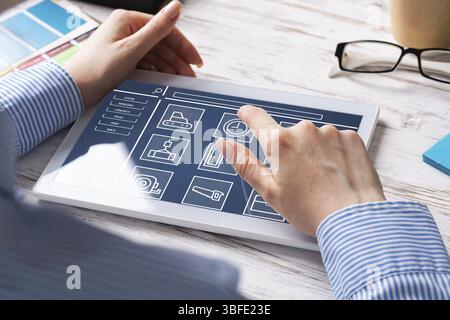 Business lady sitting at desk with tablet computer. Mobile smart devices in business processes. Business occupation and innovation. Corporate office w Stock Photo