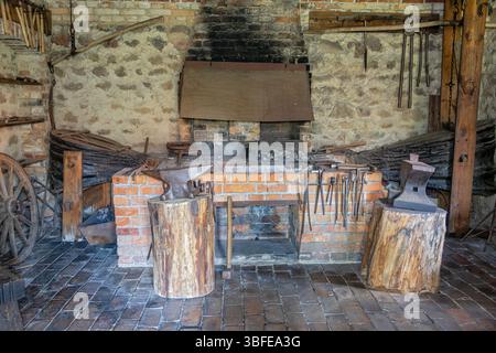 Equipment of a historic forge with a fireplace and bellows Stock Photo
